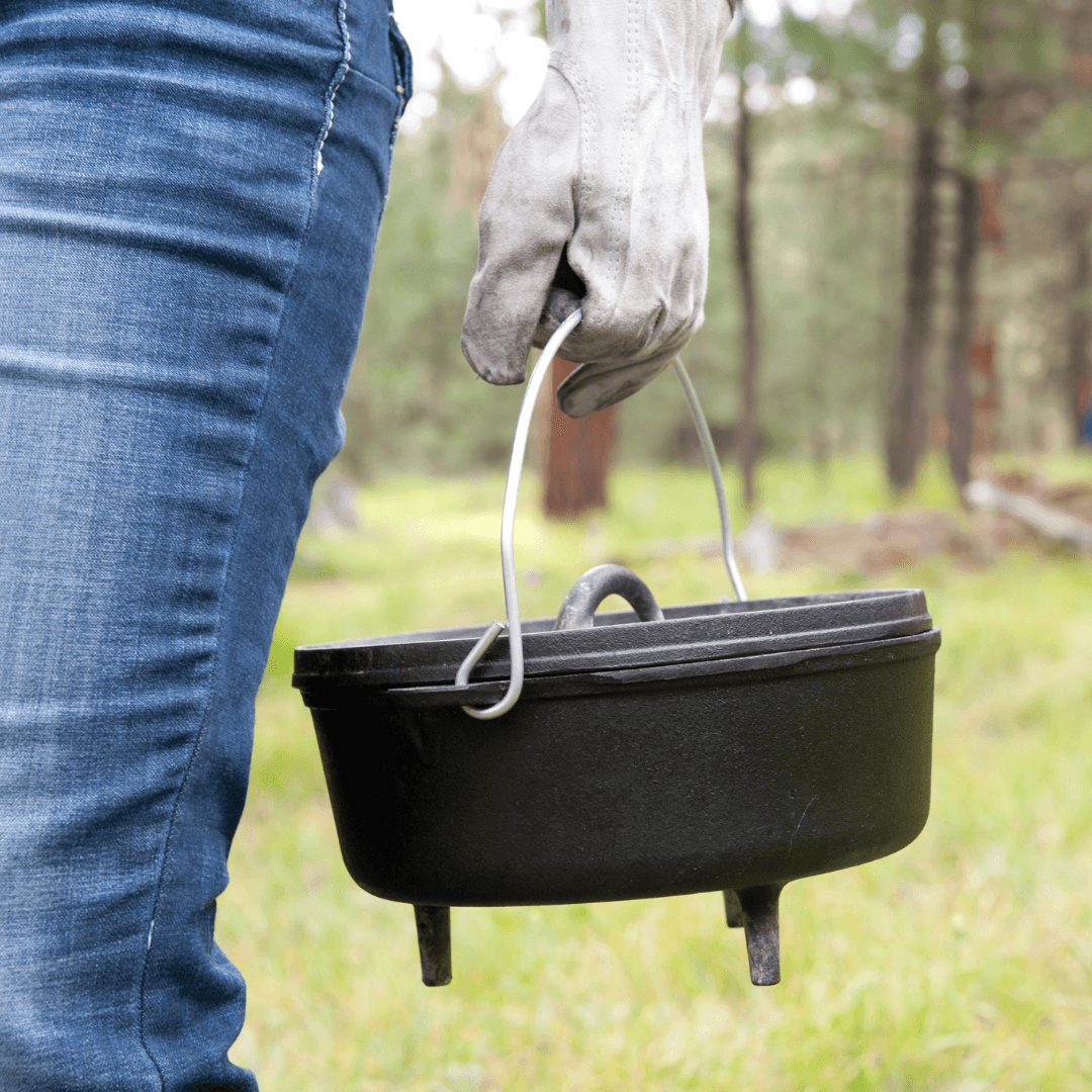 lodge dutch oven in hand