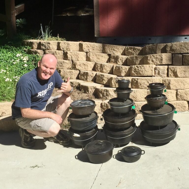 Aaron from Hitched4fun showing a variety of stacked cast iron Dutch oven sizes for camping comparison.