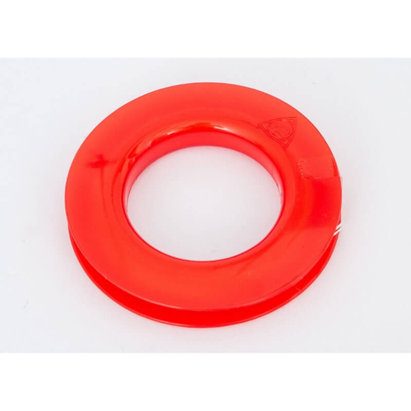 A close-up of the red plastic kite winder spool, included with the HQ DELTA RAINBOW CHECKER 2M kite.
