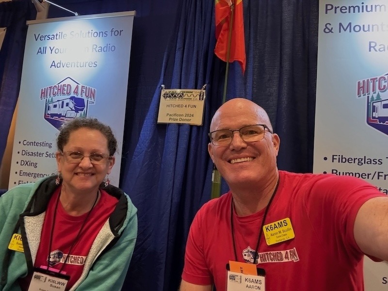 Aaron and Susan of Hitched4fun.com smiling in their vendor booth at the Pacificon ham radio convention.