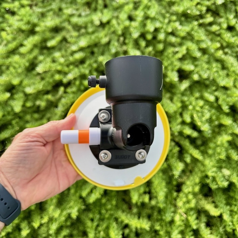 A close-up of the lower "CUP" mount for the RV Flag Pole Buddy 2.0, detailing the pole holder with its thumbscrew and the vacuum pump.