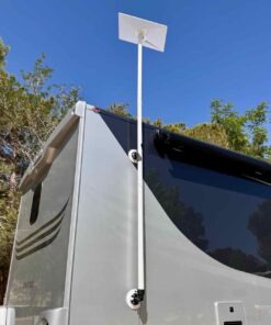 Full view of the RV Flag Pole Buddy Suction Cup Mount 2.0 kit holding a Starlink dish high above a modern silver motorhome, demonstrating a damage-free installation.