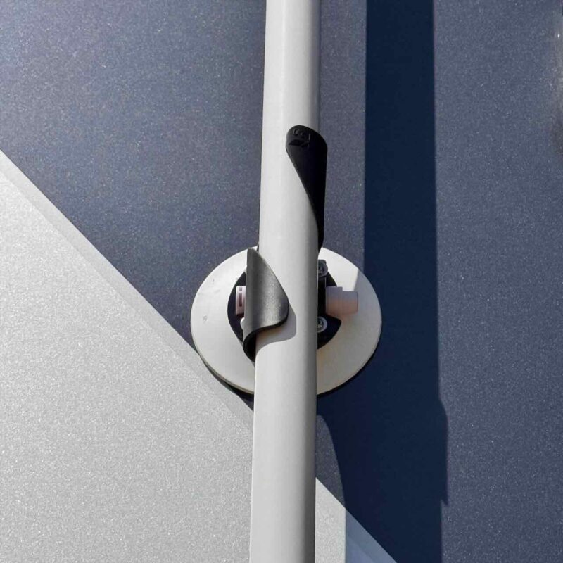 Close-up of the upper "TWIST" holder of the RV Flag Pole Buddy Suction Cup Mount 2.0, showing how the pole twists to lock securely in place.